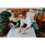 Family looking at a map for the best neighbourhoods to live in Madrid
